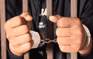credit repair companies in handcuffs behind bars